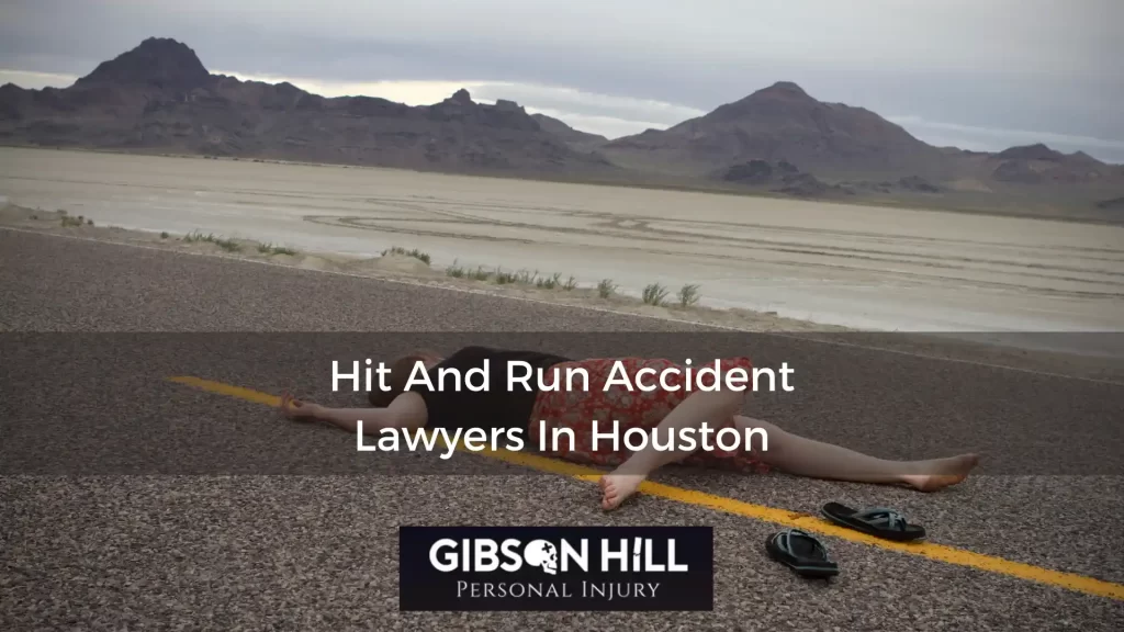 Woman without shoes lies on a road in the desert. Superimposed on the image are the words: Hit And Run Accident Lawyers In Houston